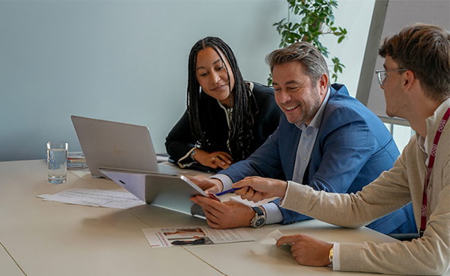 Colleagues looking at a tablet